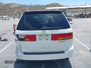 2003 Honda Odyssey EX-L z VIN 5FNRL18033B095684, wystawiony jako IAAI lot #42289617 z przebiegiem 174 336 mil mil oraz . Historia ofert i sprzedaży dostępna na DreamBid. Obrazek 16.
