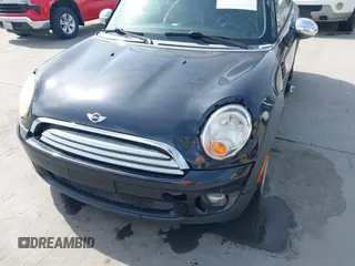 2009 MINI Hardtop with VIN WMWMF33589TW70400, listed as a IAAI auction lot 42055596 with 118,543 mi miles and . Bid and sale history available at DreamBid. Image 6.