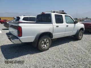 2000 Nissan Frontier XE with VIN 1N6ED27T8YC436513, listed as a Copart auction lot 60338695 with 307,757 mi miles and Clean title. Bid and sale history available at DreamBid. Image 3.