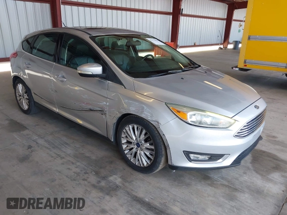 2017 Ford Focus Titanium z VIN 1FADP3N2XHL288103, wystawiony jako IAAI lot #42573844 z przebiegiem 128 952 mil mil oraz . Historia ofert i sprzedaży dostępna na DreamBid. Obrazek 1.