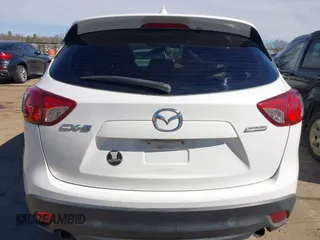 2016 Mazda CX-5 Sport with VIN JM3KE2BY9G0890587, listed as a IAAI auction lot 41685344 with 91,190 mi miles. Bid and sale history available at carsss.com. Image 16.