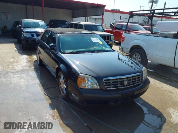 2001 Cadillac DeVille DHS z VIN 1G6KE57YX1U190955, wystawiony jako IAAI lot #41941668 z przebiegiem 191 040 mil mil oraz . Historia ofert i sprzedaży dostępna na DreamBid. Obrazek 1.