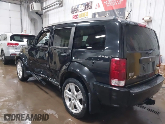 2011 Dodge Nitro Heat with VIN 1D4PU4GK1BW602572, listed as a IAAI auction lot 41529030 with 134,482 mi miles. Bid and sale history available at carsss.com. Image 3.