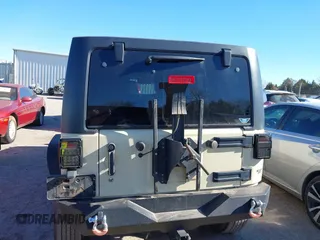 2012 Jeep Wrangler Unlimited Sport z VIN 1C4BJWDG8CL102486, wystawiony jako IAAI lot #41386649 z przebiegiem 156 993 mil mil oraz . Historia ofert i sprzedaży dostępna na DreamBid. Obrazek 16.