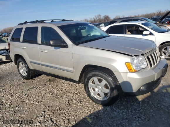 2010 Jeep Grand Cherokee Laredo with VIN 1J4RR4GT1AC106990, listed as a Copart auction lot 87421664 with 106,025 mi miles and Salvage Title. Bid and sale history available at carsss.com. Image 4.