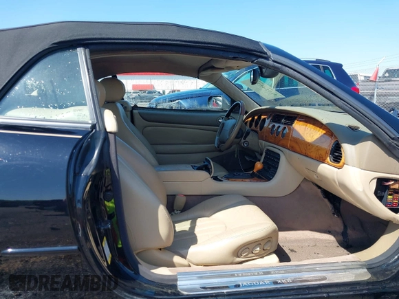 2002 Jaguar XK with VIN SAJDA42C12NA30499, listed as a IAAI auction lot 41954577 with 77,152 mi miles and . Bid and sale history available at DreamBid. Image 5.