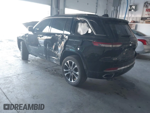 2023 Jeep Grand Cherokee Overland with VIN 1C4RJHDG5PC507978, listed as a IAAI auction lot 41394199 with 57,323 mi miles and . Bid and sale history available at DreamBid. Image 3.