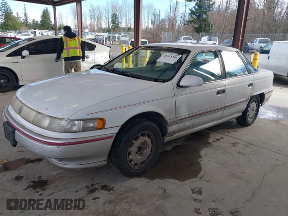 1992 Mercury Sable z VIN 1MECM5049NG647978, wystawiony jako IAAI lot #41805346 z przebiegiem 23 634 mil mil oraz . Historia ofert i sprzedaży dostępna na DreamBid. Obrazek 2.
