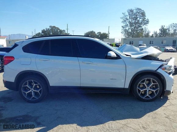 2016 BMW X1 xDrive28i with VIN WBXHT3C32G5E51855, listed as a IAAI auction lot 41634237 with 69,101 mi miles. Bid and sale history available at carsss.com. Image 12.
