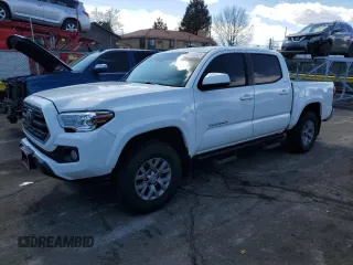 2019 Toyota Tacoma SR5 with VIN 5TFAZ5CN1KX086878, listed as a Copart auction lot 46437555 with 56,908 mi miles and Salvage title. Bid and sale history available at DreamBid. Image 1.