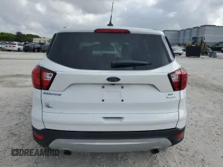 2019 Ford Escape SE z VIN 1FMCU0GD2KUB95892, wystawiony jako Copart lot #58071975 z przebiegiem Nie podano mil oraz Nie do naprawy • Non repairable. Historia ofert i sprzedaży dostępna na DreamBid. Obrazek 6.