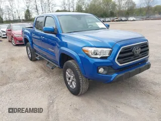 2018 Toyota Tacoma SR5 with VIN 3TMAZ5CNXJM069212, listed as a IAAI auction lot 42010564 with 73,825 mi miles and . Bid and sale history available at DreamBid. Image 1.