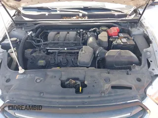 2013 Ford Taurus SEL with VIN 1FAHP2E81DG129229, listed as a IAAI auction lot 41999326 with 205,856 mi miles. Bid and sale history available at carsss.com. Image 10.