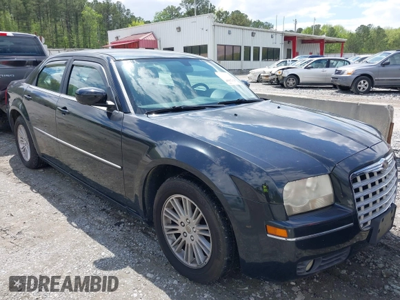 2009 Chrysler 300 Touring with VIN 2C3KA53V99H584082, listed as a IAAI auction lot 42026860 with 147,558 mi miles. Bid and sale history available at carsss.com. Image 1.