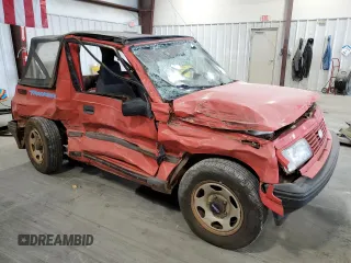 1994 Geo Tracker z VIN 2CNBE18U3R6952403, wystawiony jako Copart lot #79038524 z przebiegiem 271 461 mil mil oraz Szkody całkowita. Historia ofert i sprzedaży dostępna na DreamBid. Obrazek 4.