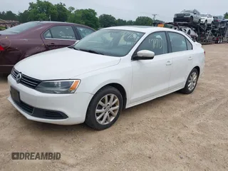 2014 Volkswagen Jetta SE with VIN 3VWD17AJ0EM371501, listed as a IAAI auction lot 42597170 with 166,686 mi miles and . Bid and sale history available at DreamBid. Image 2.