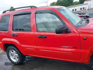 2002 Jeep Liberty Limited z VIN 1J8GL58K42W262492, wystawiony jako IAAI lot #42121270 z przebiegiem 167 662 mil mil oraz . Historia ofert i sprzedaży dostępna na DreamBid. Obrazek 14.