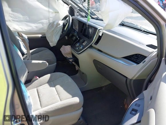 2015 Toyota Sienna L with VIN 5TDZK3DC4FS669496, listed as a IAAI auction lot 41691430 with 119,427 mi miles and . Bid and sale history available at DreamBid. Image 5.