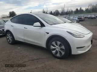 2023 Tesla Model Y Long Range with VIN 7SAYGDEE3PA130988, listed as a Copart auction lot 42172185 with 112,136 mi miles and Salvage Title. Bid and sale history available at DreamBid. Image 4.
