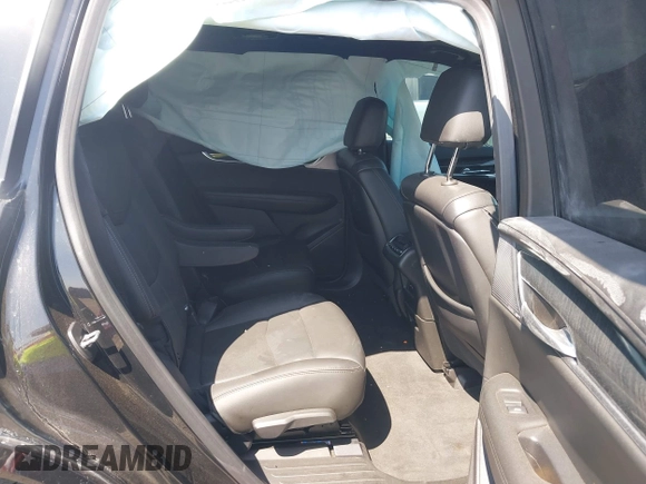 2021 Cadillac XT6 Premium Luxury z VIN 1GYKPCRS9MZ221232, wystawiony jako IAAI lot #41783431 z przebiegiem 69 367 mil mil oraz . Historia ofert i sprzedaży dostępna na DreamBid. Obrazek 8.