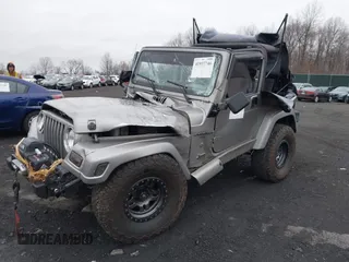 2001 Jeep Wrangler Sport with VIN 1J4FA49S41P355646, listed as a IAAI auction lot 41937746 with 160,634 mi miles. Bid and sale history available at carsss.com. Image 17.