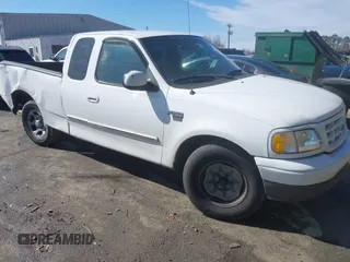 2002 Ford F-150 XL with VIN 1FTRX17L32NA13159, listed as a IAAI auction lot 41653814 with 435,395 mi miles. Bid and sale history available at carsss.com. Image 1.