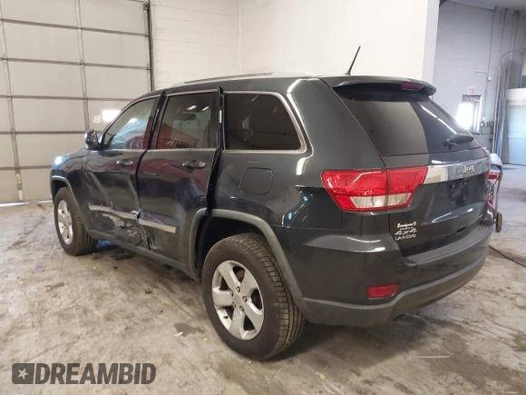 2012 Jeep Grand Cherokee Laredo with VIN 1C4RJFAG5CC351539, listed as a IAAI auction lot 41861533 with 166,909 mi miles. Bid and sale history available at carsss.com. Image 3.