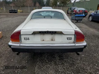 1989 Jaguar XJS z VIN SAJNA5840KC150684, wystawiony jako Copart lot #48081805 z przebiegiem 93 444 mil mil oraz Czysty tytuł • Clean title. Historia ofert i sprzedaży dostępna na DreamBid. Obrazek 6.