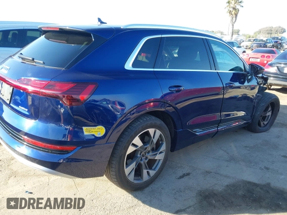 2021 Audi e-tron Premium with VIN WA1AAAGE4MB014383, listed as a IAAI auction lot 41298787 with 63,214 mi miles. Bid and sale history available at carsss.com. Image 4.