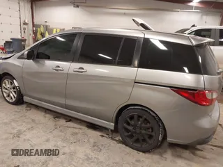 2012 Mazda 5 Touring z VIN JM1CW2CL1C0107706, wystawiony jako IAAI lot #41551479 z przebiegiem 123 418 mil mil oraz . Historia ofert i sprzedaży dostępna na DreamBid. Obrazek 3.