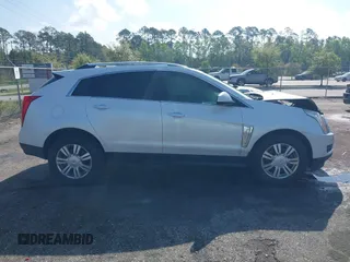 2013 Cadillac SRX Luxury Collection with VIN 3GYFNCE33DS608040, listed as a IAAI auction lot 41912860 with 128,295 mi miles and . Bid and sale history available at DreamBid. Image 13.