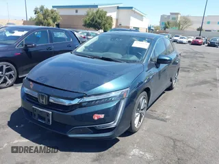 2018 Honda Clarity Touring with VIN JHMZC5F3XJC006383, listed as a IAAI auction lot 41996524 with 100,646 mi miles and . Bid and sale history available at DreamBid. Image 2.