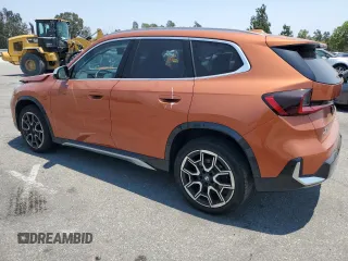 2023 BMW X1 xDrive28i with VIN WBX73EF03P5W54209, listed as a Copart auction lot 64796365 with 19,591 mi miles and Salvage title. Bid and sale history available at DreamBid. Image 2.