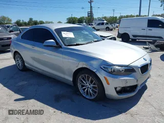 2015 BMW 2 Series 228i with VIN WBA1F5C58FV257570, listed as a IAAI auction lot 41783929 with 229,893 mi miles. Bid and sale history available at carsss.com. Image 1.
