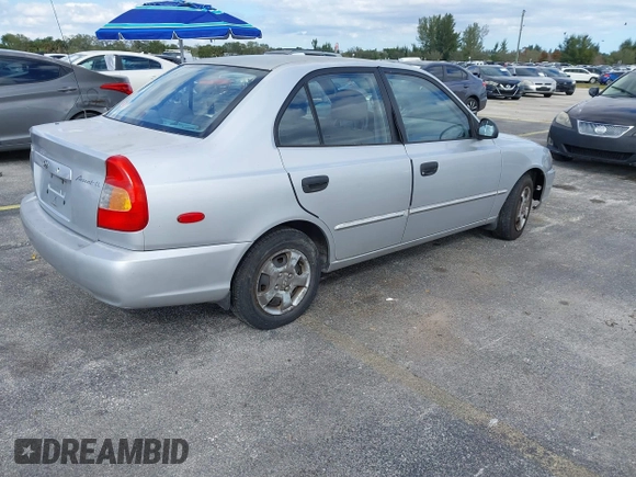 2002 Hyundai Accent GL with VIN KMHCG45C52U378454, listed as a IAAI auction lot 41418653 with 173,564 mi miles. Bid and sale history available at carsss.com. Image 4.