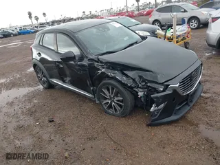 2016 Mazda CX-3 Grand Touring with VIN JM1DKBD7XG0125001, listed as a IAAI auction lot 41777712 with 42,453 mi miles. Bid and sale history available at carsss.com. Image 1.