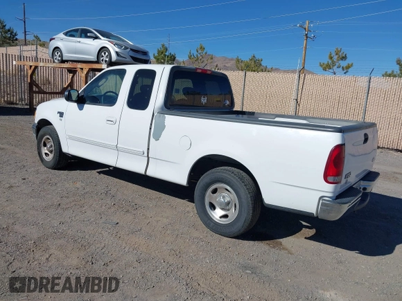 2002 Ford F-150 XL with VIN 1FTRX17W22KE34494, listed as a IAAI auction lot 41689313 with 250,243 mi miles. Bid and sale history available at carsss.com. Image 3.