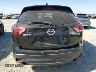 2016 Mazda CX-5 Touring z VIN JM3KE2CY5G0617516, wystawiony jako Copart lot #56421005 z przebiegiem 110 739 mil mil oraz Szkoda całkowita • Salvage title. Historia ofert i sprzedaży dostępna na DreamBid. Obrazek 6.