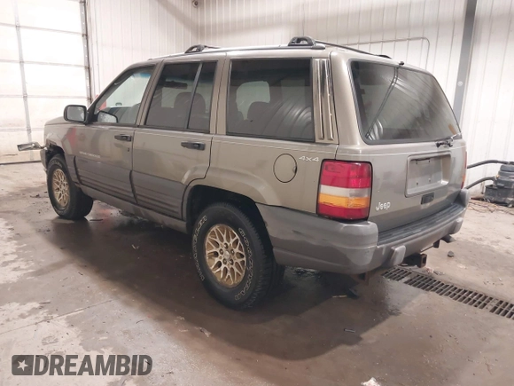 1996 Jeep Grand Cherokee Laredo with VIN 1J4GZ58S5TC182766, listed as a IAAI auction lot 41372356 with 234,390 mi miles. Bid and sale history available at carsss.com. Image 3.