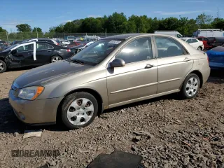 2006 Kia Spectra EX z VIN KNAFE121365269433, wystawiony jako Copart lot #56634735 z przebiegiem 86 551 mil mil oraz Szkoda całkowita • Salvage title. Historia ofert i sprzedaży dostępna na DreamBid. Obrazek 1.