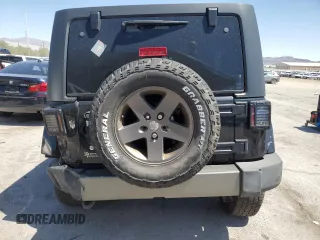 2015 Jeep Wrangler Unlimited Freedom with VIN 1C4HJWDG0FL598947, listed as a Copart auction lot 61794214 with 125,778 mi miles and Salvage title. Bid and sale history available at DreamBid. Image 6.