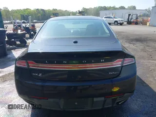 2015 Lincoln MKZ z VIN 3LN6L2G90FR602404, wystawiony jako IAAI lot #41946181 z przebiegiem 146 588 mil mil oraz . Historia ofert i sprzedaży dostępna na DreamBid. Obrazek 16.