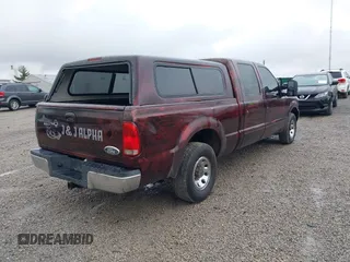 2004 Ford Super Duty F-250 XL with VIN 1FTNW20L34EA70689, listed as a IAAI auction lot 41923744 with 437,297 mi miles. Bid and sale history available at carsss.com. Image 4.