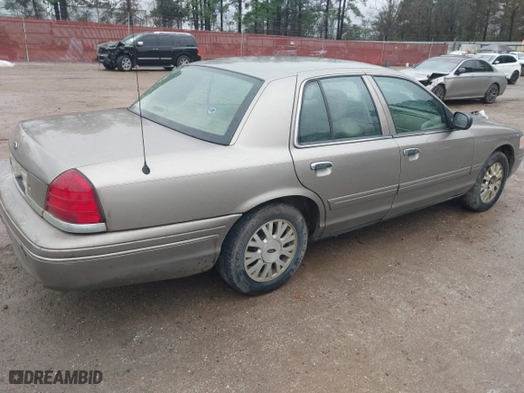 2005 Ford Crown Victoria LX with VIN 2FAFP74W05X174758, listed as a IAAI auction lot 41553606 with 192,103 mi miles. Bid and sale history available at carsss.com. Image 4.