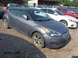 2016 Hyundai Veloster z VIN KMHTC6AD8GU277003, wystawiony jako IAAI lot #42375395 z przebiegiem 166 583 mil mil oraz . Historia ofert i sprzedaży dostępna na DreamBid. Obrazek 1.