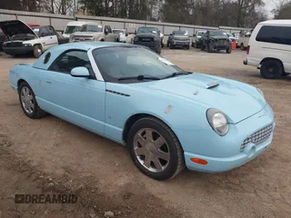 2003 Ford Thunderbird Deluxe z VIN 1FAHP60A53Y101461, wystawiony jako IAAI lot #41797831 z przebiegiem 64 760 mil mil oraz . Historia ofert i sprzedaży dostępna na DreamBid. Obrazek 1.