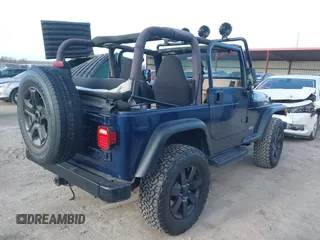 2001 Jeep Wrangler Sport with VIN 1J4FA49S41P334053, listed as a IAAI auction lot 41884967 with 158,258 mi miles. Bid and sale history available at carsss.com. Image 4.
