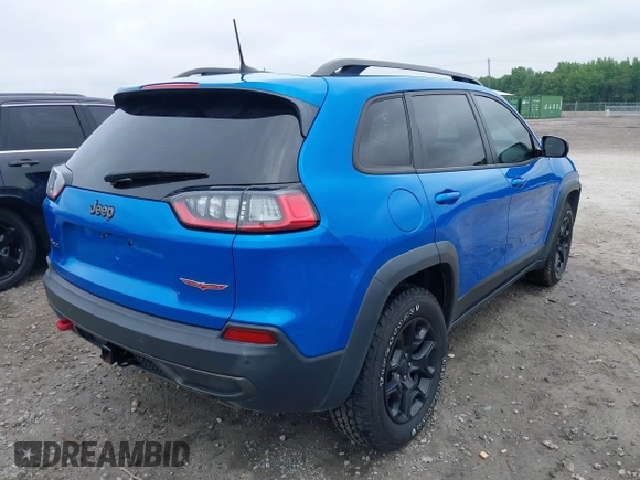 2019 Jeep Cherokee Trailhawk with VIN 1C4PJMBX0KD141577, listed as a IAAI auction lot 42413454 with 122,386 mi miles and . Bid and sale history available at DreamBid. Image 4.