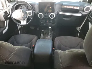 2014 Jeep Wrangler Unlimited Sahara with VIN 1C4BJWEG1EL210949, listed as a Copart auction lot 60977555 with 122,495 mi miles and Salvage title. Bid and sale history available at DreamBid. Image 8.