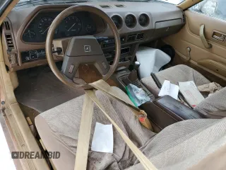 1979 Datsun 280ZX z VIN HS130137808, wystawiony jako Copart lot #43799165 z przebiegiem 28 995 mil mil oraz Tytuł czysty. Historia ofert i sprzedaży dostępna na DreamBid. Obrazek 8.